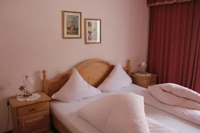 Ein Bett oder Betten in einem Zimmer der Unterkunft Waldvilla am See