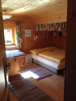 Ein Bett oder Betten in einem Zimmer der Unterkunft Ferienhaus Zirmheim