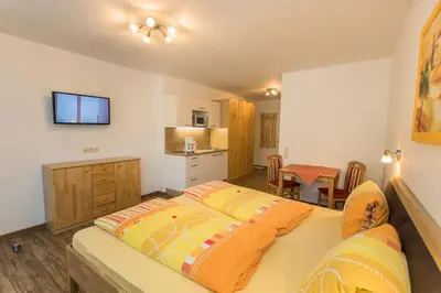Ein Bett oder Betten in einem Zimmer der Unterkunft Appartment Hotel Mitterer