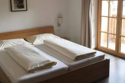 Ein Bett oder Betten in einem Zimmer der Unterkunft Ski in Ski out Saalbach Zentrum JokerCard inkusive