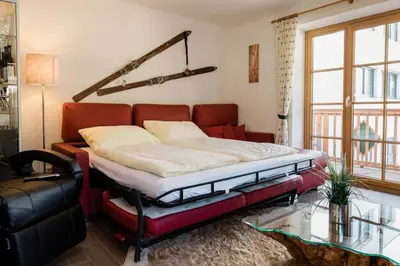 Ein Bett oder Betten in einem Zimmer der Unterkunft Ski in Ski out Saalbach Zentrum JokerCard inkusive
