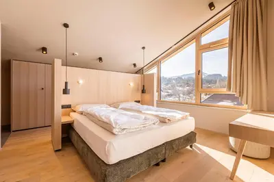 Ein Bett oder Betten in einem Zimmer der Unterkunft Kitzbühel Suites by ALPS RESORTS
