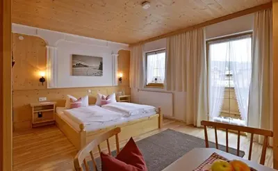 Ein Bett oder Betten in einem Zimmer der Unterkunft Hüttschmiedhof