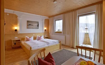 Ein Bett oder Betten in einem Zimmer der Unterkunft Hüttschmiedhof