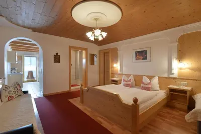 Ein Bett oder Betten in einem Zimmer der Unterkunft Hüttschmiedhof