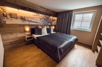 Ein Bett oder Betten in einem Zimmer der Unterkunft Chalet Arena