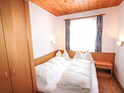 Ein Bett oder Betten in einem Zimmer der Unterkunft Apartment Voithofer-4 by Interhome