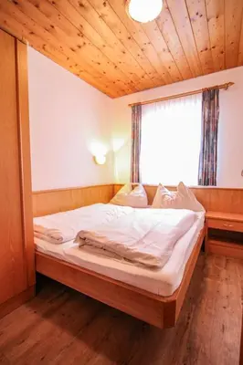 Ein Bett oder Betten in einem Zimmer der Unterkunft Apartment Voithofer-4 by Interhome
