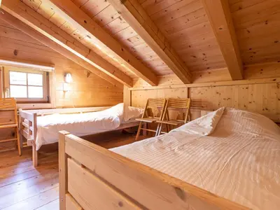 Ein Bett oder Betten in einem Zimmer der Unterkunft Chalet Königsleiten 2 by Interhome