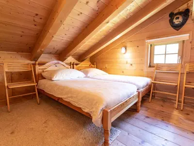 Ein Bett oder Betten in einem Zimmer der Unterkunft Chalet Königsleiten 2 by Interhome