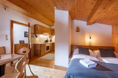 Ein Bett oder Betten in einem Zimmer der Unterkunft Au Alm Appartements