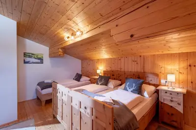 Ein Bett oder Betten in einem Zimmer der Unterkunft Au Alm Appartements