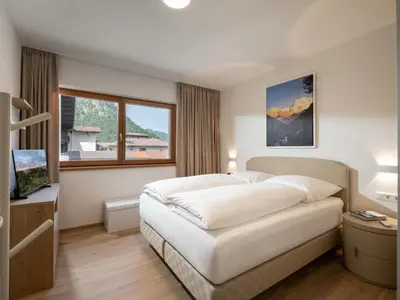 Ein Bett oder Betten in einem Zimmer der Unterkunft Herzi Chalet - top ausgestattet, neu, chic und sehr gemütlich