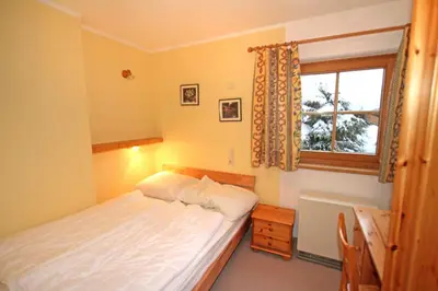 Ein Bett oder Betten in einem Zimmer der Unterkunft Ferienwohnung Königsleiten 210 - Top 1