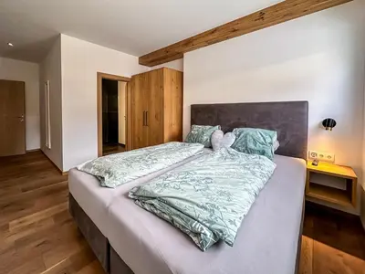 Ein Bett oder Betten in einem Zimmer der Unterkunft Our's Living - modern Apartments with Sauna near Kitzbüheler Alpen ski lift