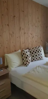 Ein Bett oder Betten in einem Zimmer der Unterkunft Casa Alpina Apartment - Pool&Sauna - by Hermann Weiss