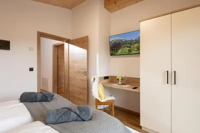 Ein Bett oder Betten in einem Zimmer der Unterkunft Ferienhäuser Kaiserluft Chalet