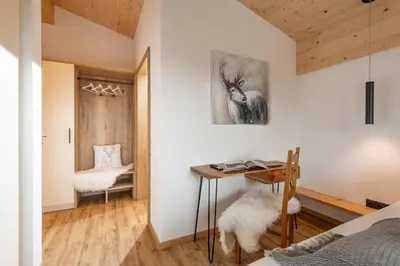 Ein Bett oder Betten in einem Zimmer der Unterkunft Ferienhäuser Kaiserluft Chalet