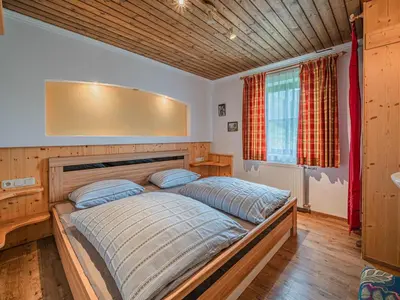 Ein Bett oder Betten in einem Zimmer der Unterkunft Poschen