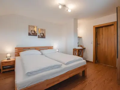 Ein Bett oder Betten in einem Zimmer der Unterkunft Apartment Hüttaler by Interhome