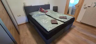 Ein Bett oder Betten in einem Zimmer der Unterkunft Ferienwohnung Trixi