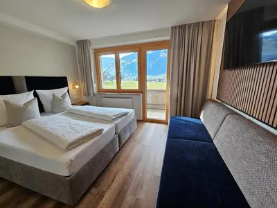 Ein Bett oder Betten in einem Zimmer der Unterkunft Alpenzeit Zillertal Apartments