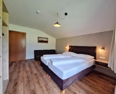 Ein Bett oder Betten in einem Zimmer der Unterkunft Alpenzeit Zillertal Apartments