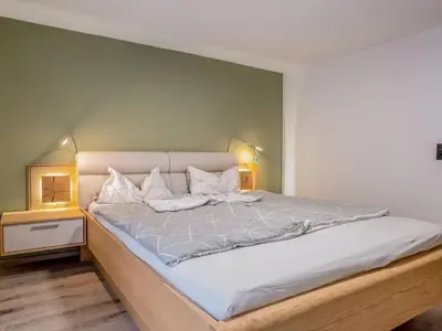Ein Bett oder Betten in einem Zimmer der Unterkunft Blumenwiese I