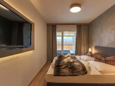 Ein Bett oder Betten in einem Zimmer der Unterkunft Kitzbüheler Alpenlodge Top A2 und A3