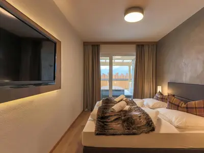 Ein Bett oder Betten in einem Zimmer der Unterkunft Kitzbüheler Alpenlodge Top A2