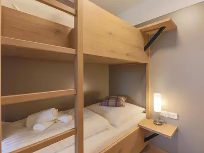 Ein Bett oder Betten in einem Zimmer der Unterkunft Kitzbüheler Alpenlodge Top A2