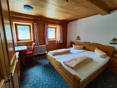 Ein Bett oder Betten in einem Zimmer der Unterkunft Gasthaus Mitterjager