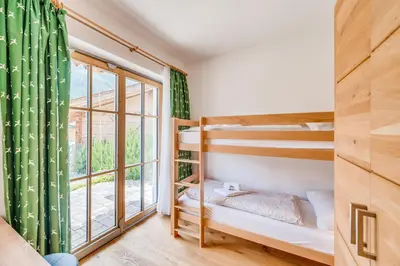 Ein Bett oder Betten in einem Zimmer der Unterkunft Chalet #4 - Edelweiss