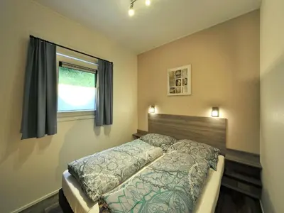 Ein Bett oder Betten in einem Zimmer der Unterkunft Chalet in the Seeblick campsite in Kramsach
