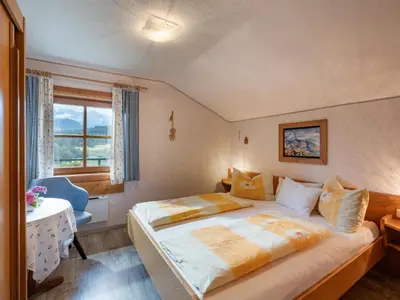 Ein Bett oder Betten in einem Zimmer der Unterkunft Ferienhaus Riedlsperger