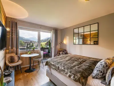 Ein Bett oder Betten in einem Zimmer der Unterkunft Alpines Nest by Apartment Managers