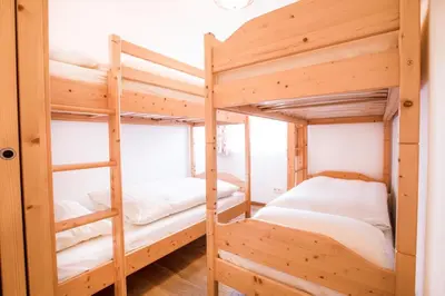 Ein Bett oder Betten in einem Zimmer der Unterkunft Ferienwohnung Hochkrimml 19 __1-4