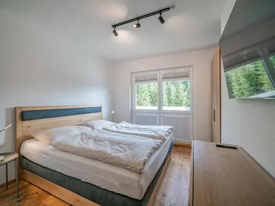 Ein Bett oder Betten in einem Zimmer der Unterkunft Kitzbüheler Alpenlodge Top A8