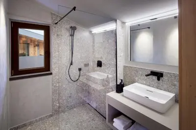 Ein Badezimmer in der Unterkunft Alpin Residenzen Eichenheim Aurach bei Kitzbühel by Alpina-Holiday