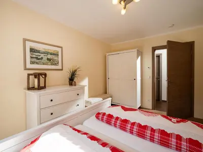 Ein Bett oder Betten in einem Zimmer der Unterkunft Alpensuiten