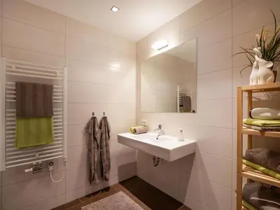 Ein Badezimmer in der Unterkunft Alpensuiten