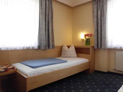 Ein Bett oder Betten in einem Zimmer der Unterkunft Ferienwohnungen Rahm