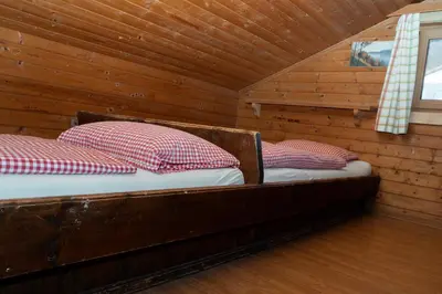 Ein Bett oder Betten in einem Zimmer der Unterkunft SÖLLHOF Ferienhaus mit 11 Schlafzimmern I großer Gemeinschaftsraum I Skibushaltestelle I 10 Min zum Skigebiet