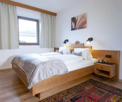 Ein Bett oder Betten in einem Zimmer der Unterkunft Haus Alpin