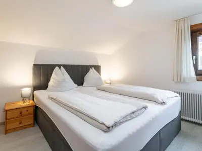 Ein Bett oder Betten in einem Zimmer der Unterkunft Rettenstein und Gaisbergblick