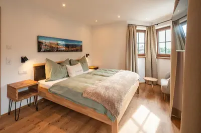 Ein Bett oder Betten in einem Zimmer der Unterkunft Apartments Fliegerbichl - Familie Voithofer