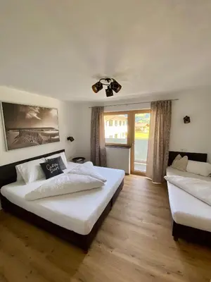 Ein Bett oder Betten in einem Zimmer der Unterkunft Apart Alpenherz