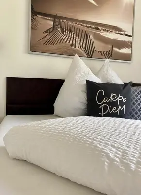 Ein Bett oder Betten in einem Zimmer der Unterkunft Apart Alpenherz