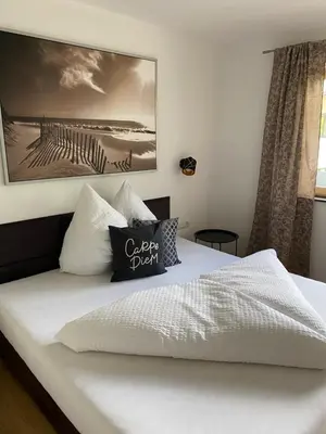 Ein Bett oder Betten in einem Zimmer der Unterkunft Apart Alpenherz
