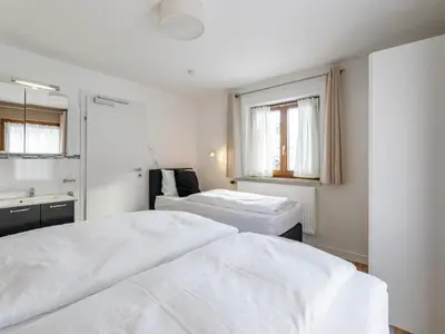 Ein Bett oder Betten in einem Zimmer der Unterkunft Neva S Saalbach